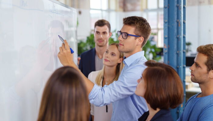 Employee in front of a whiteboard